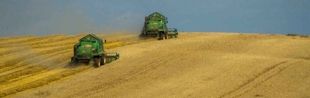 Two Green Farming harvesters working in a field